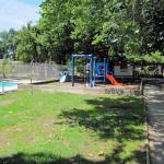 The same view adjusted to the right that includes some swings and slides.