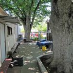 The pathway next to the outside eating area that goes by the Kindergarten classroom and leads to the front  Preschool play area where a stage will be built for Preschoolers.