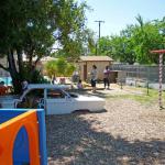 You are looking in the direction of the pool standing in the swing and sandbox play area. There is also a Chevrolet Corvair car in this play area (the car is inoperable).